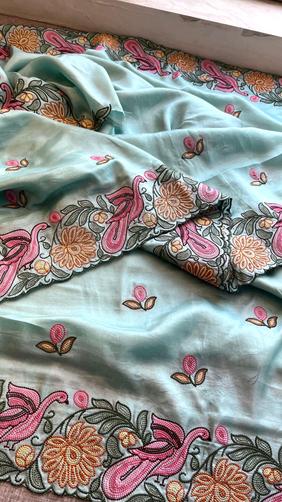 Pastel Blue Munga Silk Saree with Hand Embroidered Peacock & Floral Motifs,