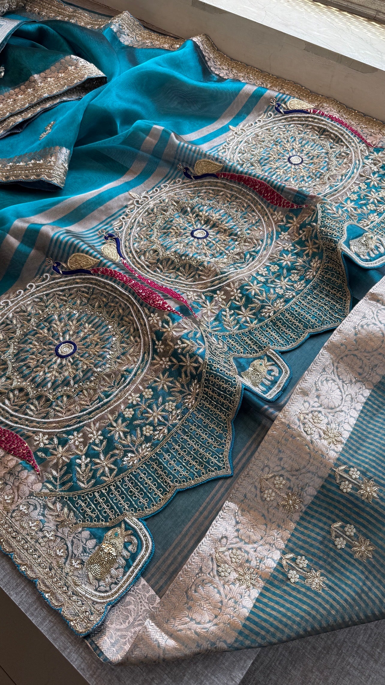 Tissue silk Saree with peacock handwork