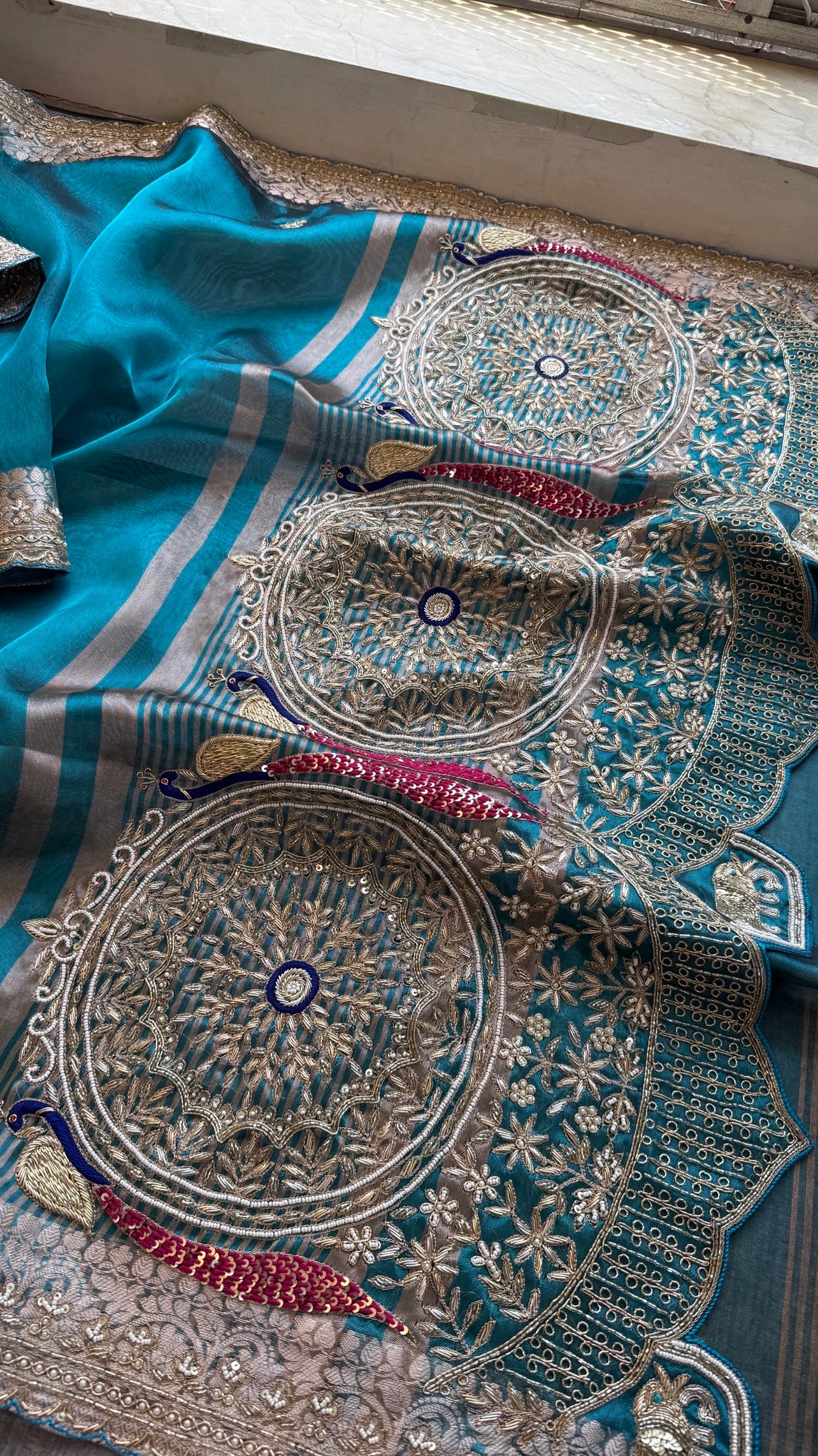 Tissue silk Saree with peacock handwork