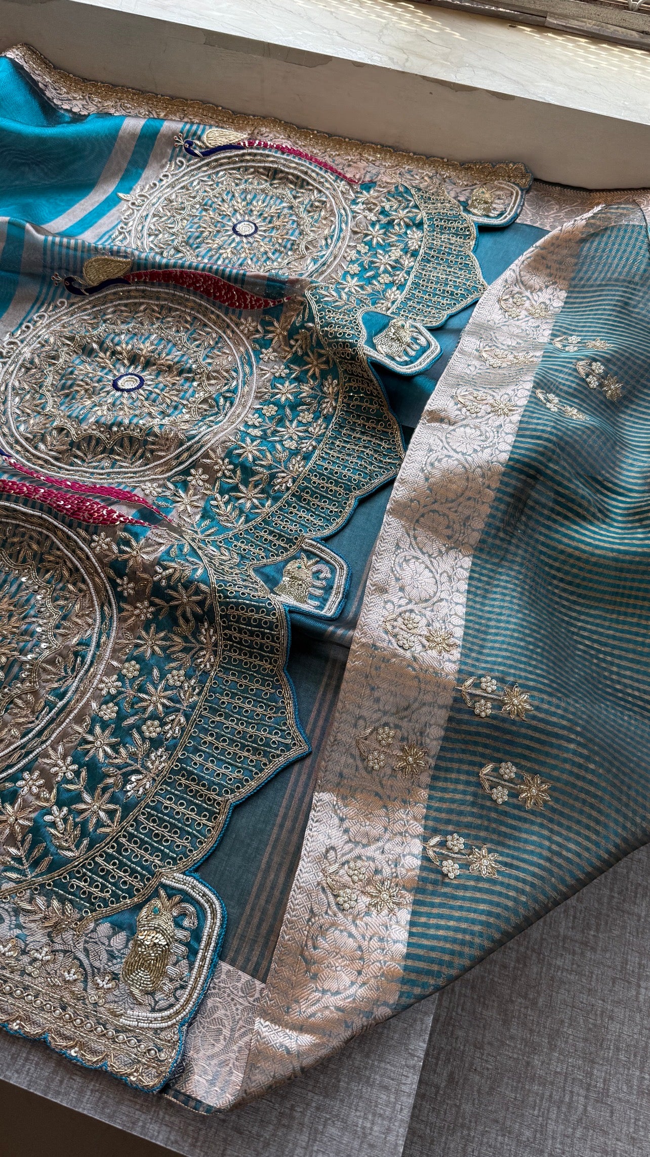 Tissue silk Saree with peacock handwork