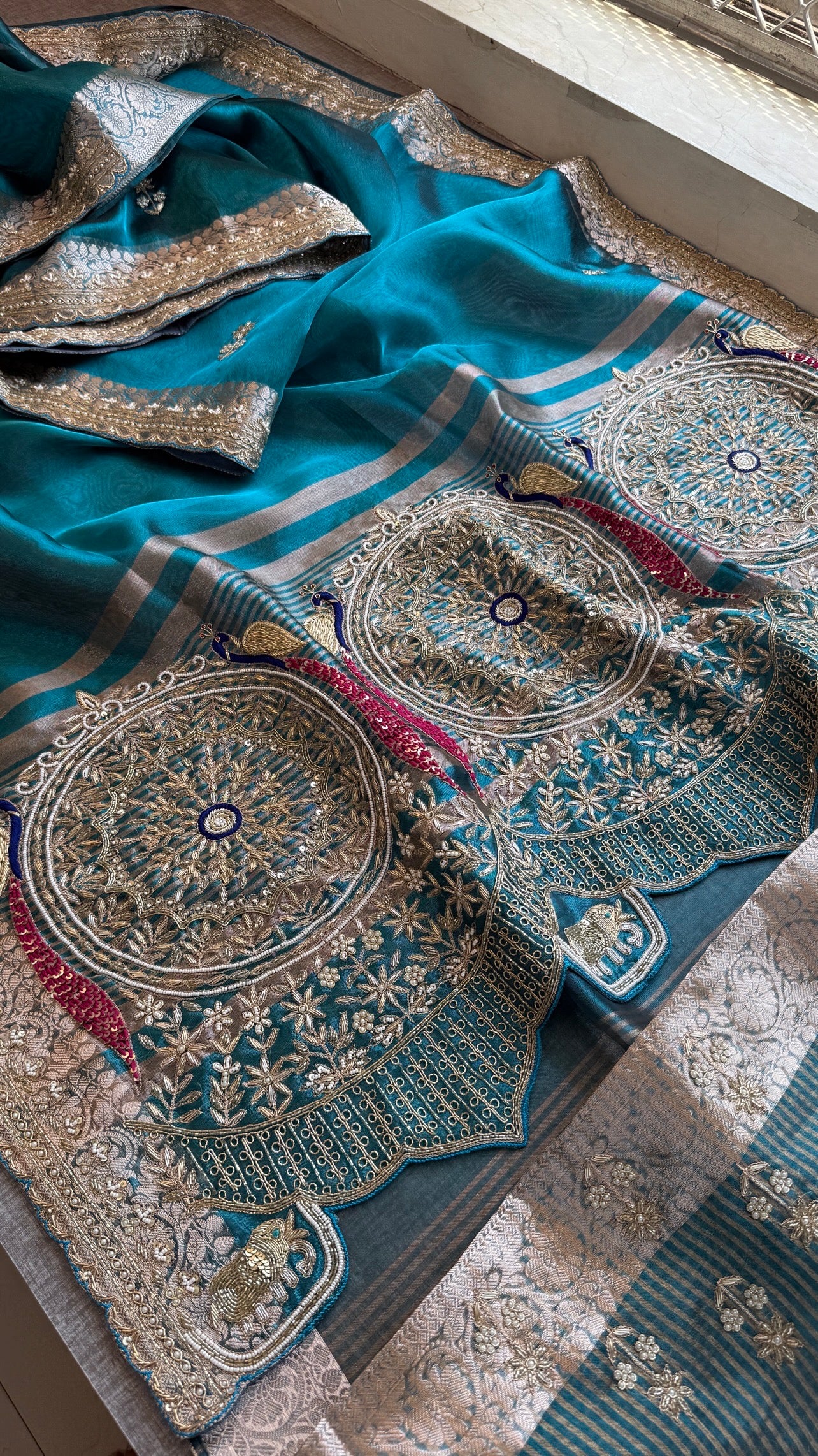 Tissue silk Saree with peacock handwork