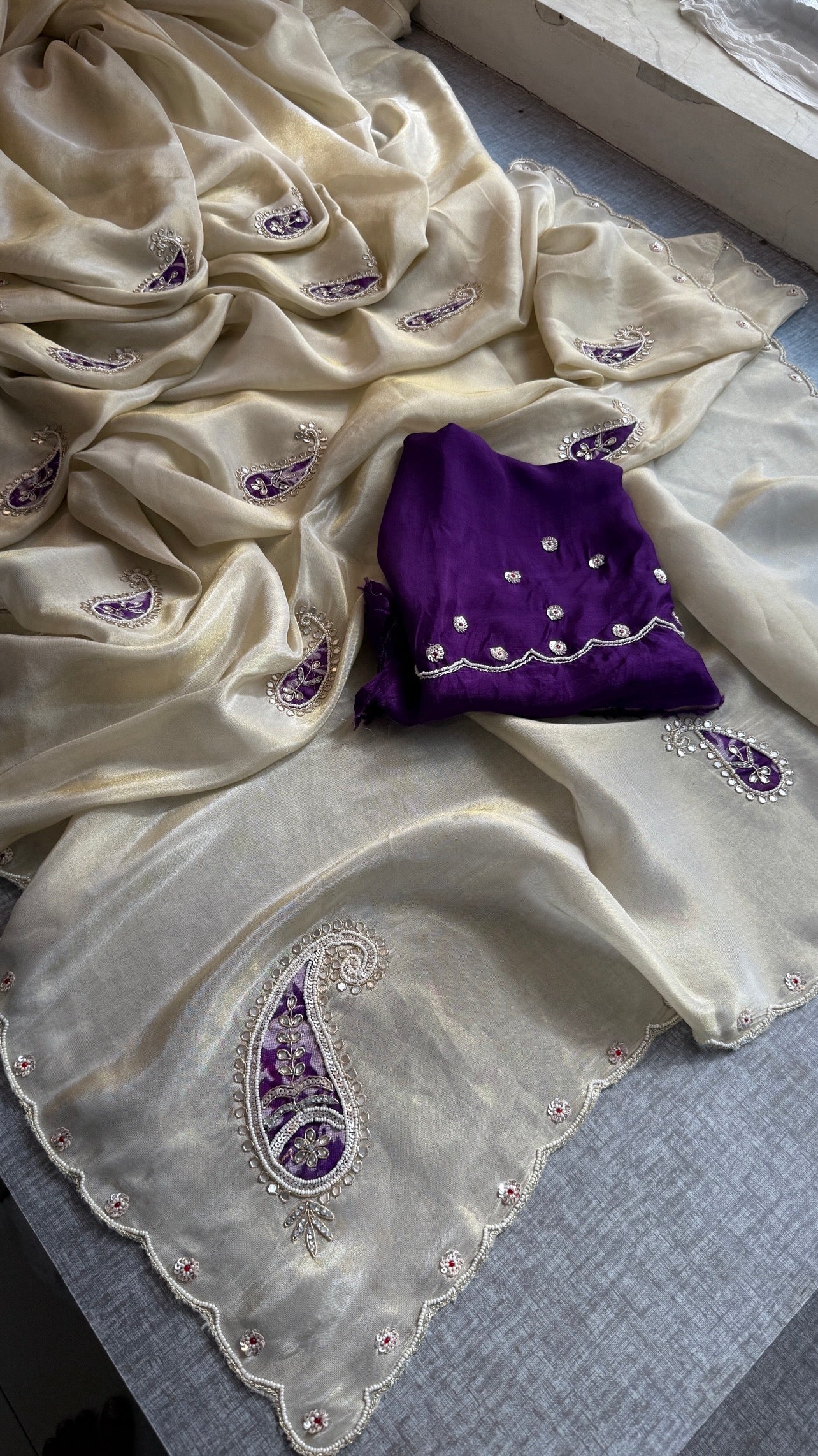 Pure Cosmo Tissue Silk Saree | Ivory & Purple Paisley Aari Work Saree | Sequin & Moti Embroidery | Scalloped Border